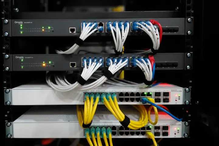Patch panel with UTP and fibre cables routed into network switches