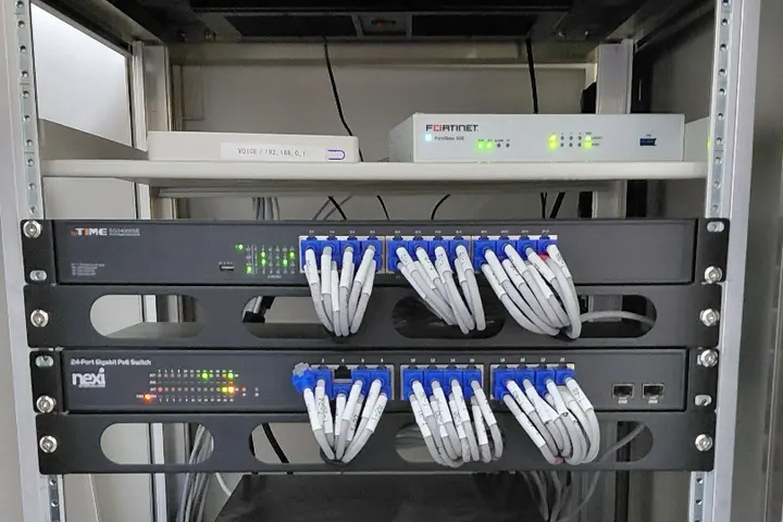 Patch panel and network switches built into a communications rack